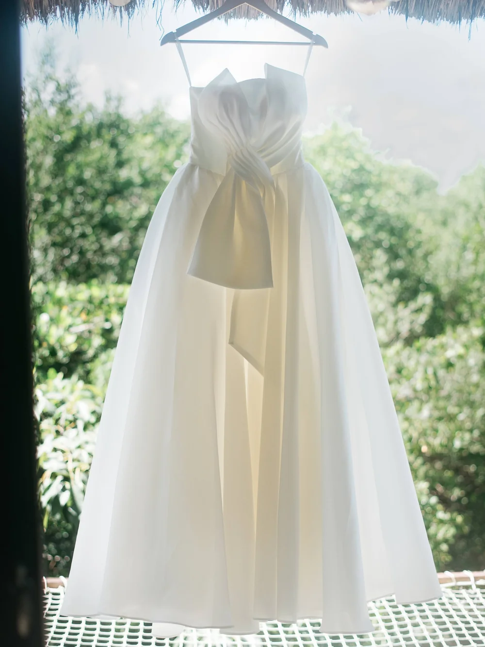 Elegant Strapless White Satin Wedding Gown with Draped Bow - Picture 1 of 4